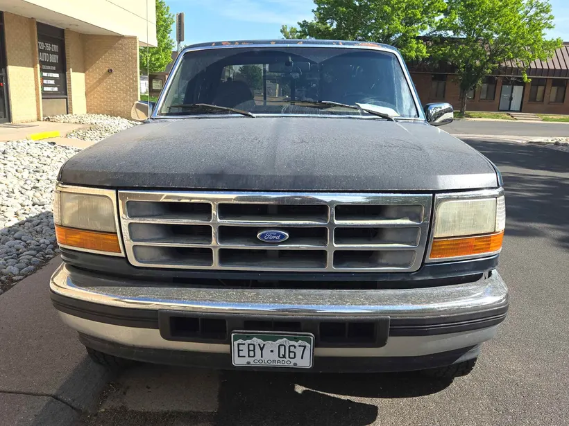 Ford F-150 with oxidized, faded paint before refinishing
