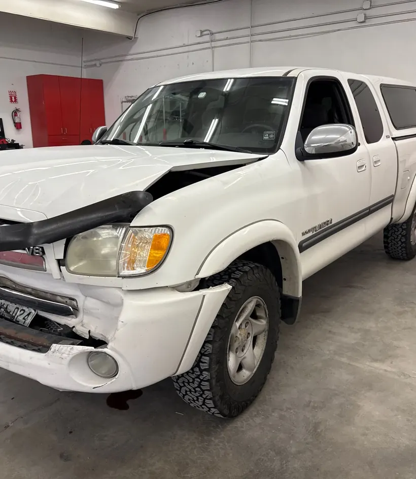 Collision-damaged truck in the CCS shop during repair