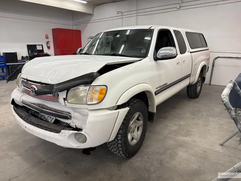 Truck with structural front-end damage on the frame bench at CCS