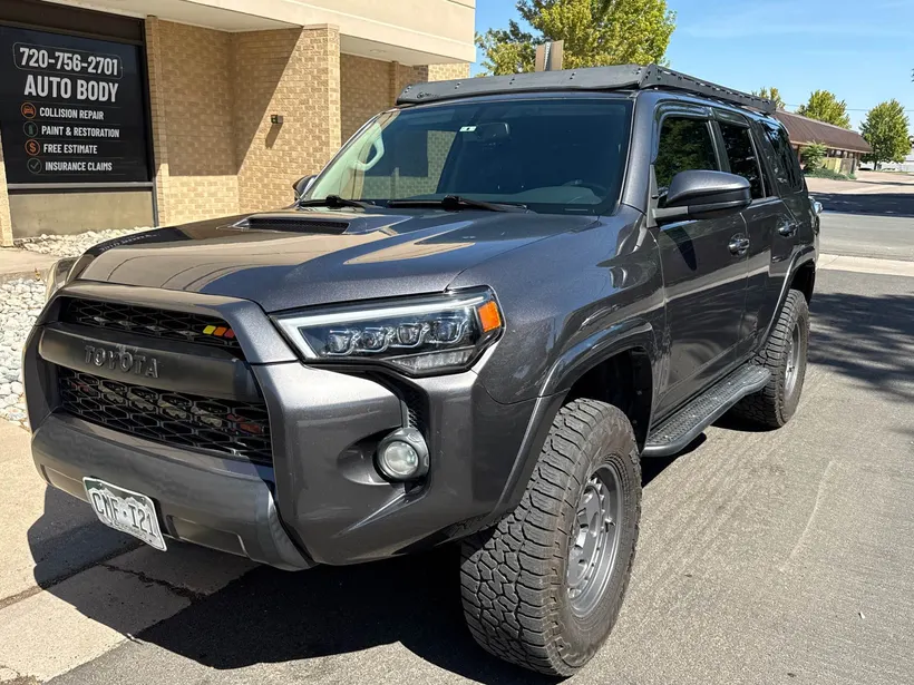 Lifted Toyota 4Runner TRD in front of CCS Auto Body Repair in Englewood
